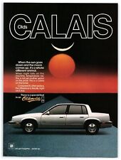 1986 GM Oldsmobile Calais Sedan Print Ad, Sun Goes Down Red Moon Comes Up 80's picture