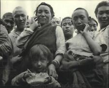 1959 Press Photo Little Tibetan refugee eats rice & lentils proveded by CARE picture