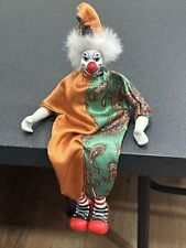 vintage sitting porcelain multi color clown figurine  picture