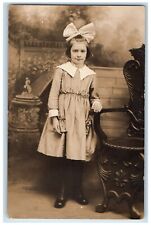 c1910's Studio Portrait Girl Child Cute Bow Dress RPPC Photo Unposted Postcard picture