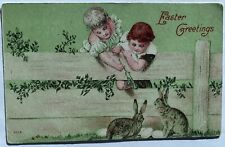 Charming Antique Easter Postcard Children Leaning Over Fence Feeding Rabbits picture