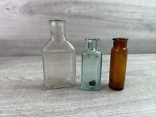 Lot Of 3 Vintage Quack Medicine Bottles Embossed Aqua, Amber & Clear picture