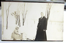 1908-15 RPPC Real Photo Postcard Of Baby in Soap Box Sled With Mom Standing by picture