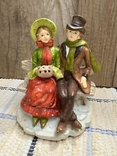 Vintage RB Figurine of Victorian Couple Sitting on a Bench in Winter picture