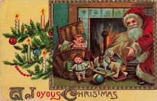 A Joyous Christmas Santa Claus with Toys Fireplace Tree 1913 Postcard picture