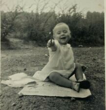 Smiling Baby Sitting On Newspaper Vintage B&W Photograph Snapshot 2.75 x 4.5 picture