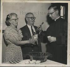 1959 Press Photo Clergyman and parents chat over punch bowl in Albany, New York picture