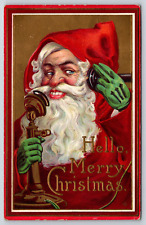 Old Antique Vintage Postcard Merry Christmas Santa Smiling On Telephone Embossed picture