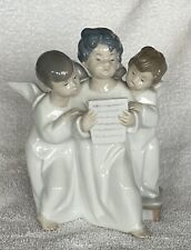 Three children singing Llardro figurine picture