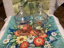 TWO VINTAGE GLASS JARS WITH LIDS picture