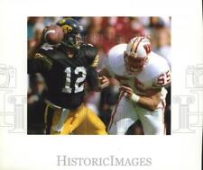 1992 Press Photo Chad Yocum pressuring quarterback Jim Hartlieb of the Hawkeyes picture