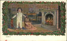 Christmas Cute Little Boy Fireplace Holly Border c1910 Vintage Postcard picture