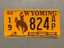 VINTAGE 1983 WYOMING LICENSE PLATE BUCKING BRONCO /FENCE 19-824AP MINT🤠 picture