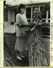 1986 Press Photo Tracy Adams with a child in a tree - saa01182 picture