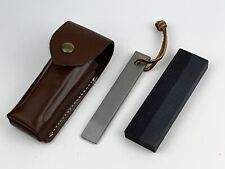 1990s Gerber sportsman's knife sharpening steel/stone with leather sheath. picture