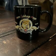 MGM Lion Logo  Coffee Cup Mug Black with Lion Very Small Chip Above Handle picture