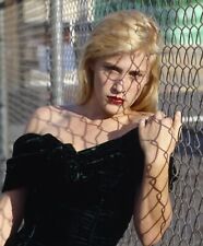 PATRICIA ARQUETTE - VERY INTERESTING HEADSHOT ALONG A FENCE  picture