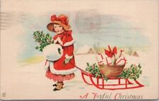 Vintage CHRISTMAS Postcard Girl with Basket of Gifts & Holly on Sled 1924 Cancel picture