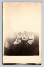 c1904-1918 RPPC Postcard Two Women and Man Sit in Field picture