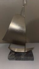 Silver Colored Metal Sailing Ship on Gray Stone picture