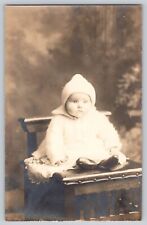 Postcard RPPC Photo Cute Baby In Beanie Hat Sitting On Chair Vintage c1910 picture