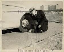 1943 Press Photo Richard Barry examines highway in Long Island City, NY picture