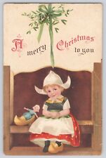 Postcard Merry Christmas Signed Ellen Clapsaddle Dutch Girl With Doll Clogs UDB picture