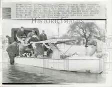 1957 Press Photo Family being evacuated from flooded home in Edinburg, Texas picture
