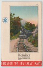 Postcard Bridgton on the Lakes, ME.  With Bridgton Harrison Railroad Train picture