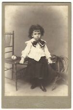 PORTRAIT OF A FASHIONABLE CURLY HAIRED CHILD IN NEW YORK   (PROFESSOR EHRLICH) picture