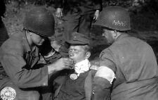WWII B&W Photo US Army Medics with Wounded German POW  WW2 World War Two / 1041 picture