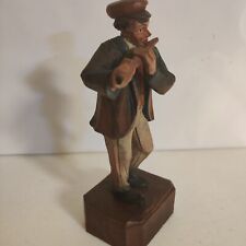 Hand carved vintage street musician flute player picture