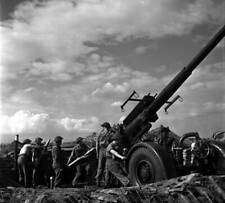 A British anti-aircraft gun crew action operating a QF 37-inch - 1941 Old Photo picture