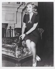 Barbara Stanwyck sits on edge of chair in living room 1940's 8x10 inch photo picture