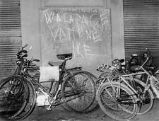 Some bicycles parked against wall protest writing We want work pea- Old Photo picture
