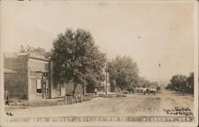 RPPC Clarkson,NE Main Street looking North Colfax County Nebraska Postcard picture
