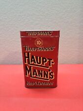 VINTAGE ADVERTISING  EMPTY HAUPT- MANN'S  TOBACCO TIN picture