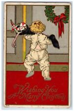 c1910's Christmas Boy Carrying Stockings Full Of Toys Embossed Antique Postcard picture