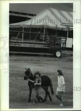 1994 Press Photo Kids walk their pony around Altamont Fairgrounds in New York picture