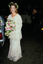 Claudia Christian wearing a wedding dress holds a bouquet 1980s Old Photo picture