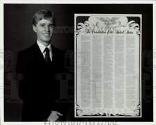 1987 Press Photo Brad Taylor showing The Constitution of the United States picture