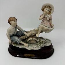 VINTAGE GIUSEPPE ARMANI ON THE SEE-SAW SCULPTURE picture