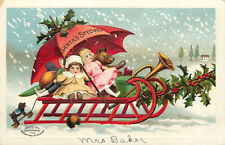 Embossed Christmas Postcard Santa's Special Snow Sled With Dolls & Teddy Bear picture