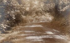 Postcard RPPC Dirt Road Bend Sun Filtering Through Trees Unidentified picture