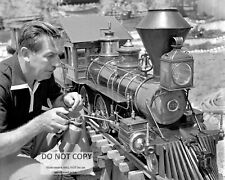WALT DISNEY WORKING ON HIS MODEL RAILROAD TRAIN - 8X10 PHOTO (DA-086) picture