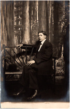 Serious Dapper Man Sitting on Bench in Suit Studio Photo 1900s RPPC Postcard picture