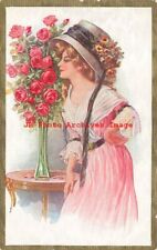 Unsigned Reynolds, Woman Smelling Bouquet of Roses in Vase on Table picture