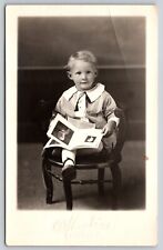 Postcard RPPC Boy Holding a Photo Book Child Real Photo picture