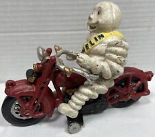 Vintage Cast Iron Michelin Man Riding Motorcycle picture