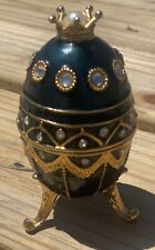 Decorative metal and enamel egg music box with crown picture